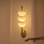 Triple Alabaster Wall Lamp — product setting and fixture profile, three stone shades on a brass wall frame (view 2)