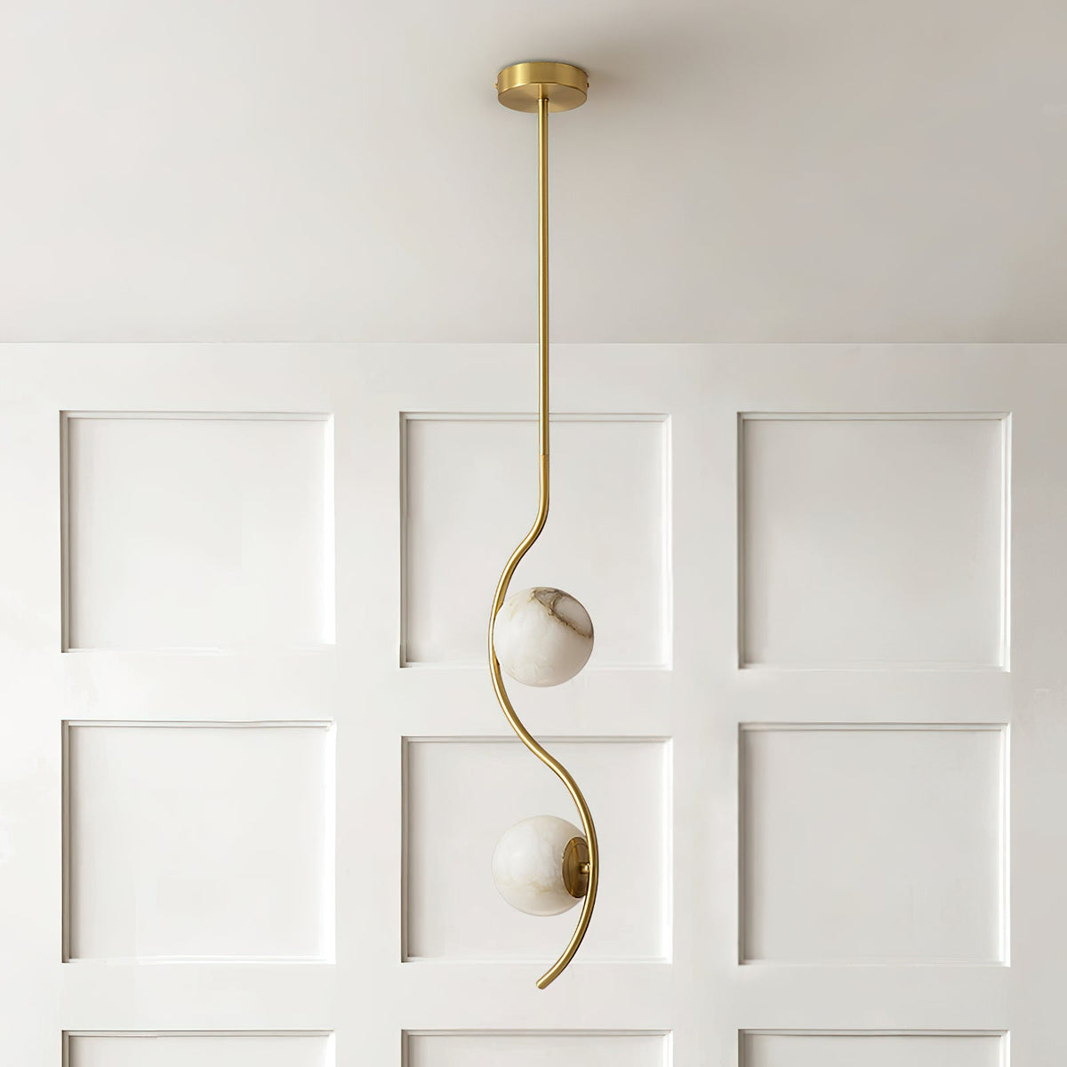 Uva Curved Pendant Lamp — additional product view, a stone shade carried by curved brass hardware (view 5)