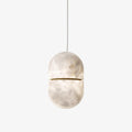 YUM Alabaster Pendant Light — full fixture profile, a suspended stone form with a balanced geometric profile (view 1)