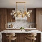 Britannica glass chandelier above a kitchen island