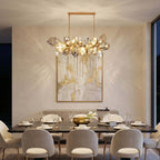 Britannica horizontal glass chandelier above a dining table