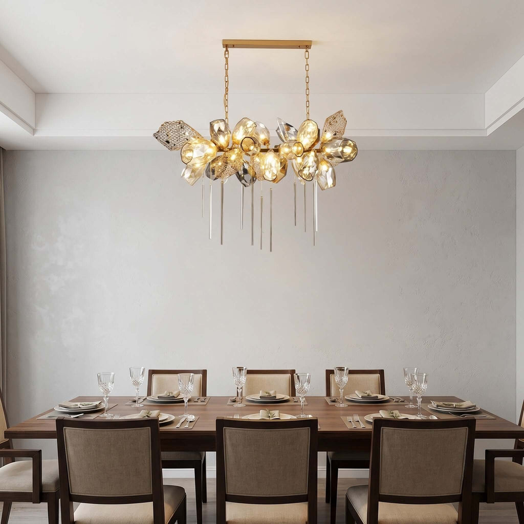 Britannica linear chandelier with faceted glass above a dining table