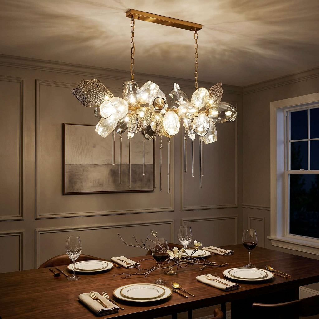 Britannica horizontal chandelier above a dining table at night