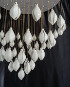 Ceramic Magnolia Staircase Chandelier living room view with cascading flower lights