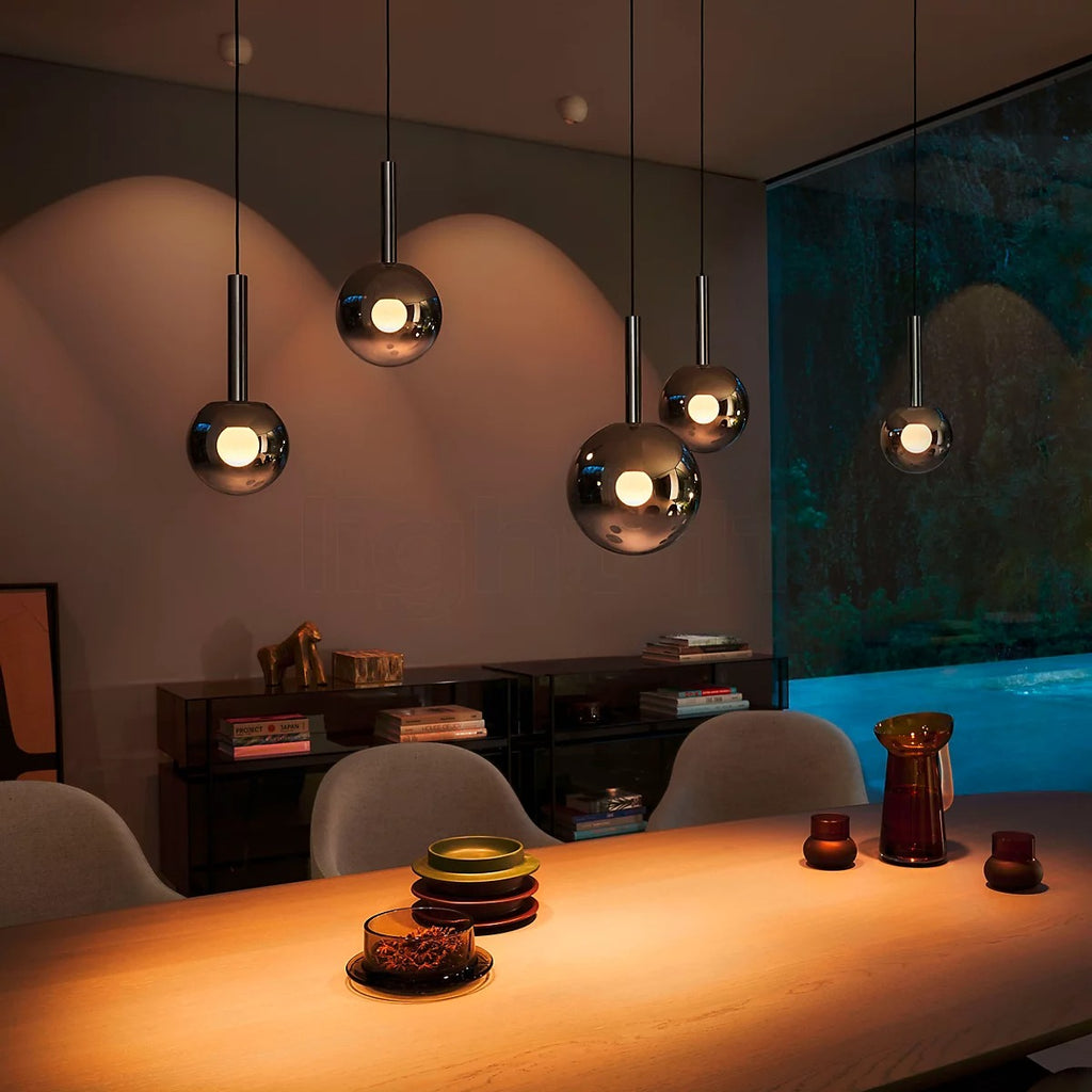 Modern Cleo Bubble smoke glass pendant chandelier lighting an evening dining room