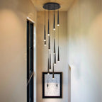Contemporary Black LED Pendant Light for Stairwell displayed in a narrow hallway stairwell