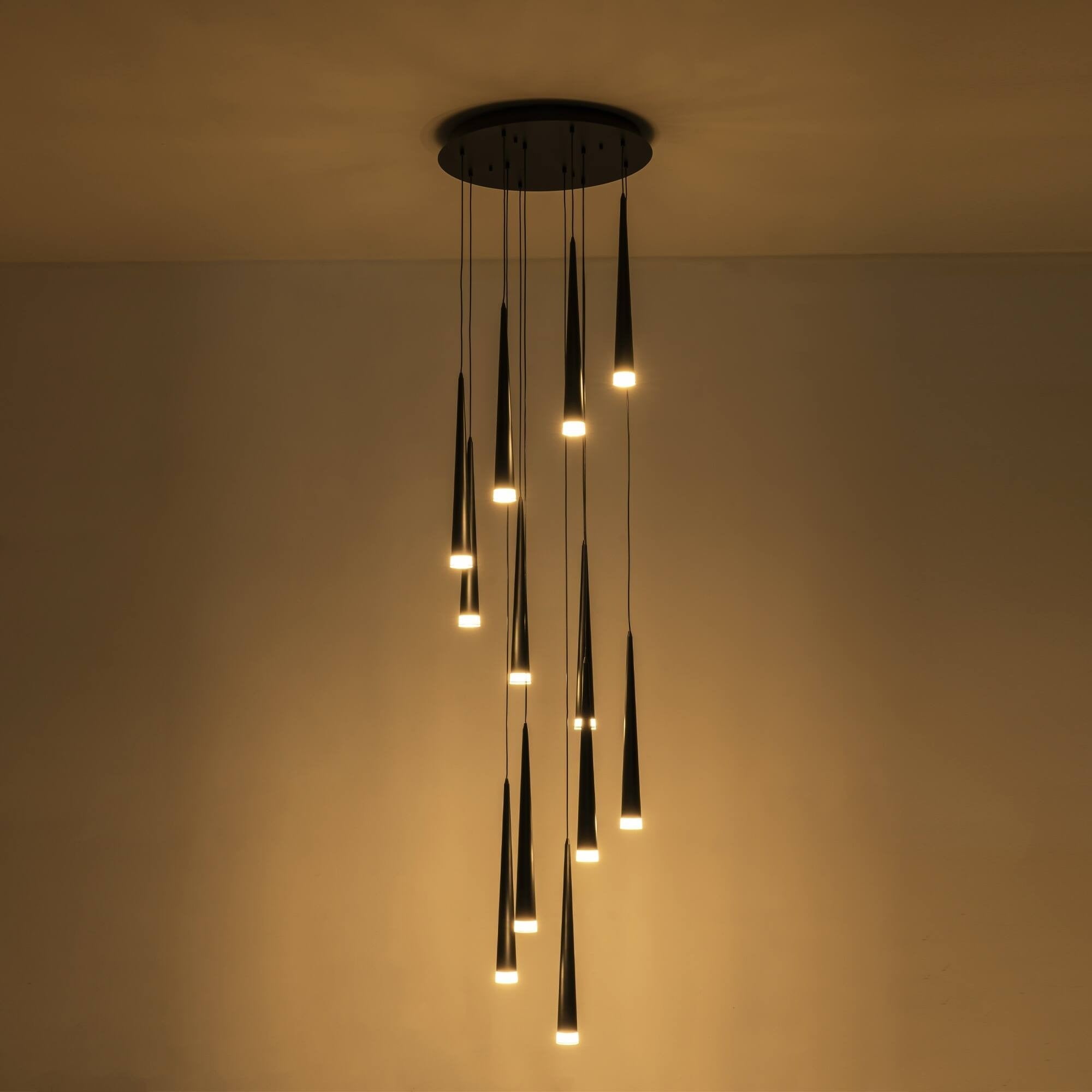 Contemporary Black LED Pendant Light for Stairwell with warm LED cone pendants lit in a cluster