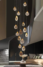 Contemporary LED Chandelier with Crystal Pendant in a black staircase living room with cascading illuminated crystal discs