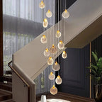 Contemporary LED Chandelier with Crystal Pendant installed beside a staircase with sheer curtains and warm crystal pendants