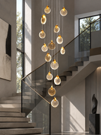 Contemporary LED chandelier with crystal pendant in modern staircase