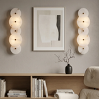 Cosmic Round Alabaster Wall Sconce by Bling Lighting Studio