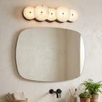 Cosmic Round Alabaster Wall Sconce by Bling Lighting Studio