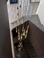 Crystal Raindrop Cascade Staircase Chandelier viewed from above with illuminated crystal drops