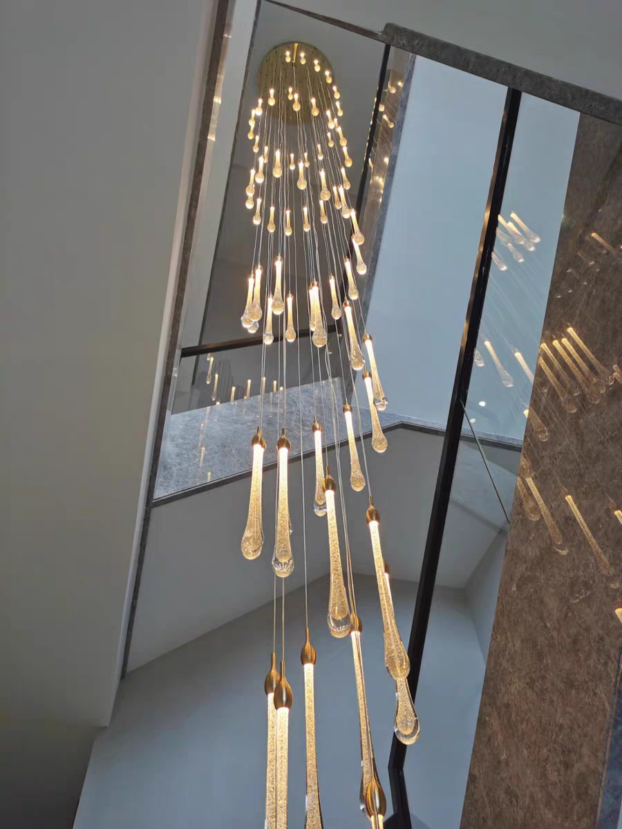 Crystal Raindrop Cascade Chandelier showing the illuminated crystal arrangement beneath the ceiling canopy