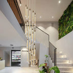 Crystal Raindrop Cascade Staircase Chandelier with illuminated gold crystal teardrops in a modern stairwell