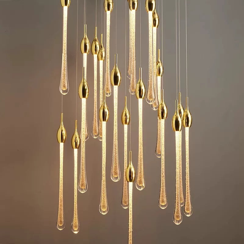 Crystal Raindrop Cascade Staircase Chandelier close view with illuminated gold crystal teardrop pendants