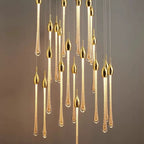 Crystal Raindrop Cascade Staircase Chandelier close view with illuminated gold crystal teardrop pendants