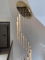 Crystal Raindrop Cascade Chandelier with polished gold canopy and vertical crystal LED drops for staircase lighting