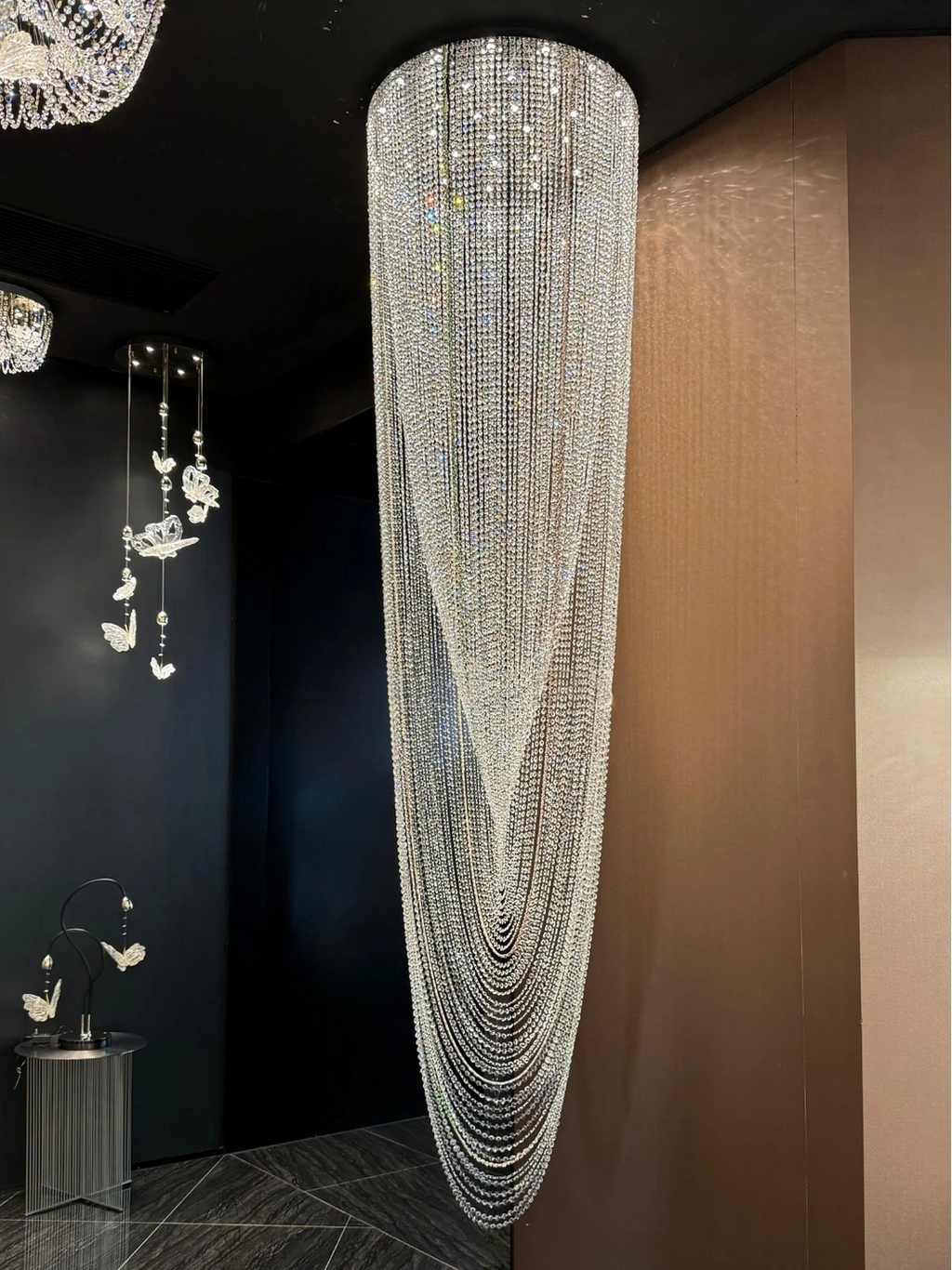 Crystal Tassel Chandelier for Staircase & Foyer bright waterfall crystal chandelier installation scene