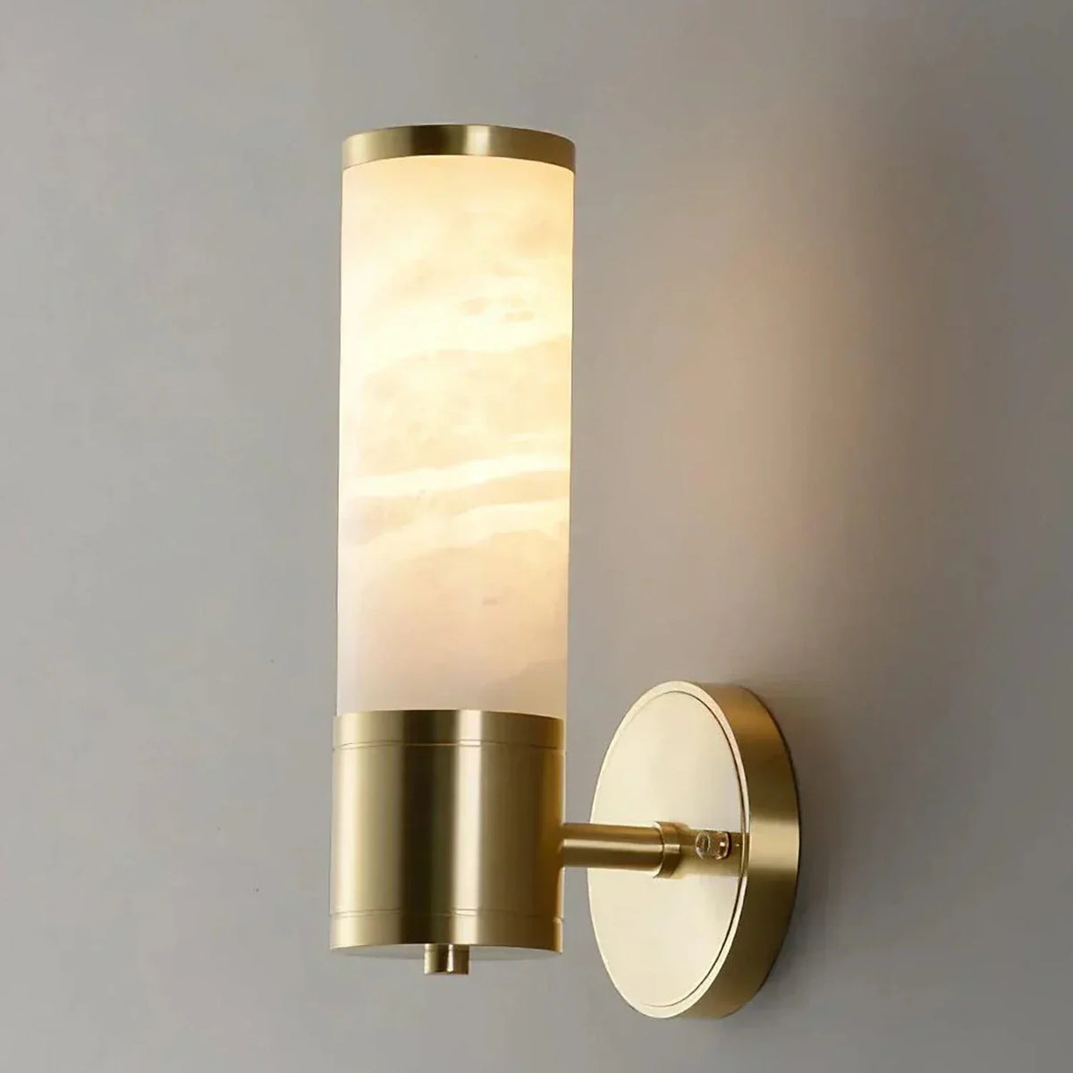 Cylindrical Lampatrin Alabaster Wall Lamp chandelier in a tall interior