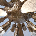 Dandelion chandelier brass hub and glass arm construction detail