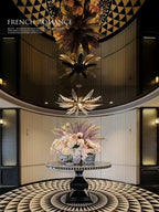 Dandelion multi-tier glass chandelier installation in a hotel lobby