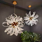 Pair of Dandelion round glass chandeliers installed in a dark room scene
