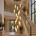 Darlen Alabaster Modern Staircase Chandelier above a grand staircase with cascading tube pendants
