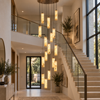Darlen Alabaster Modern Staircase Chandelier above a grand staircase with cascading tube pendants