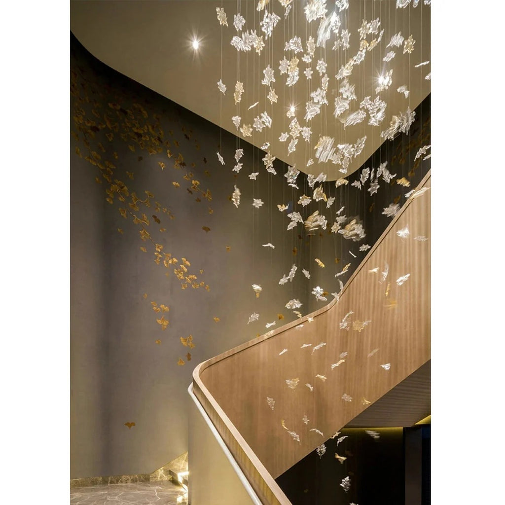 Glass Maple Leaf Hanging Light for Staircase with cascading leaves along a curved staircase wall