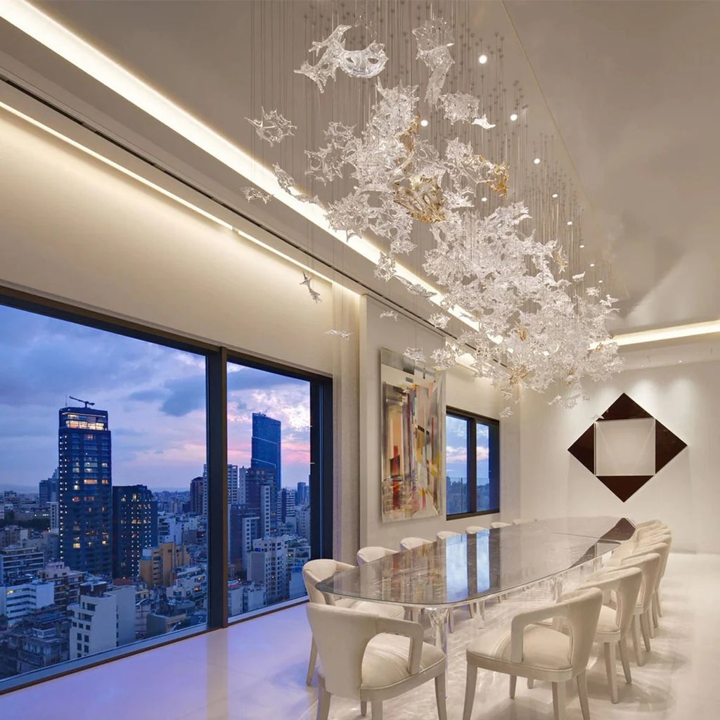 Glass Maple Leaf Hanging Light for Staircase installed above a dining area beside large city windows