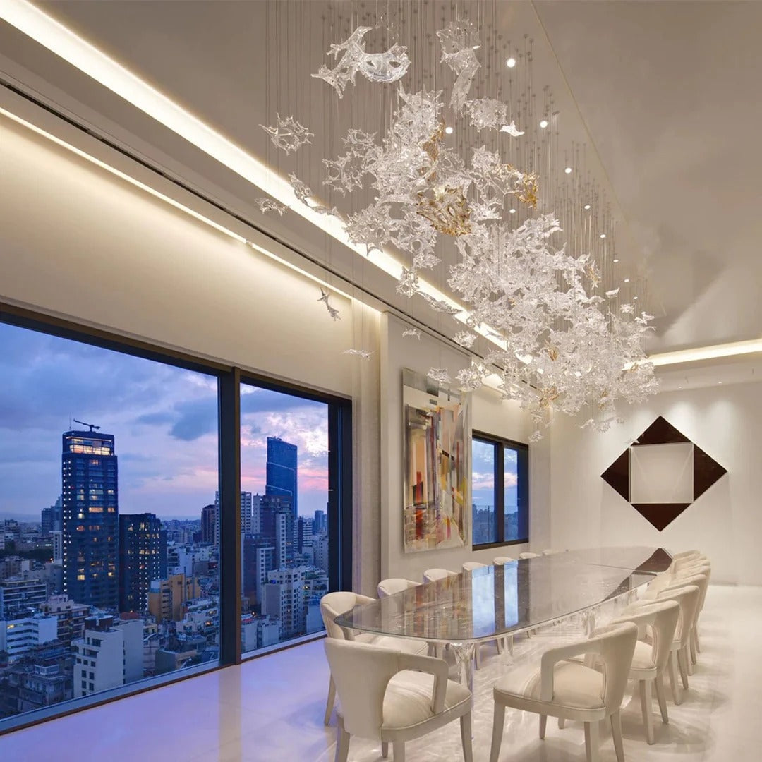 Glass Maple Leaf Hanging Light for Staircase installed above a dining area beside large city windows