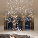 Glass Maple Leaf Hanging Light for Staircase installed in a grand lobby with tall windows and hanging leaves