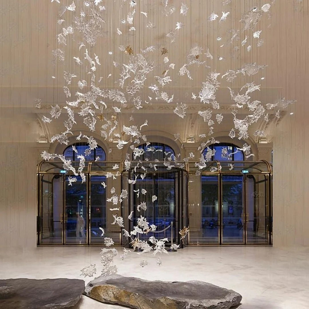 Glass Maple Leaf Hanging Light for Staircase installed in a grand lobby with tall windows and hanging leaves