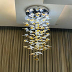 Glass Maple Leaf Hanging Light for Staircase with round canopy and cascading leaves in front of curtains
