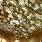 Glass Maple Leaf Hanging Light for Staircase close view under a wood ceiling with many suspended leaves