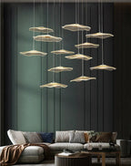 Gold Acrylic Flower Led Chandelier For Stairwell, Staircase displayed in a modern living room with layered acrylic flower pendants