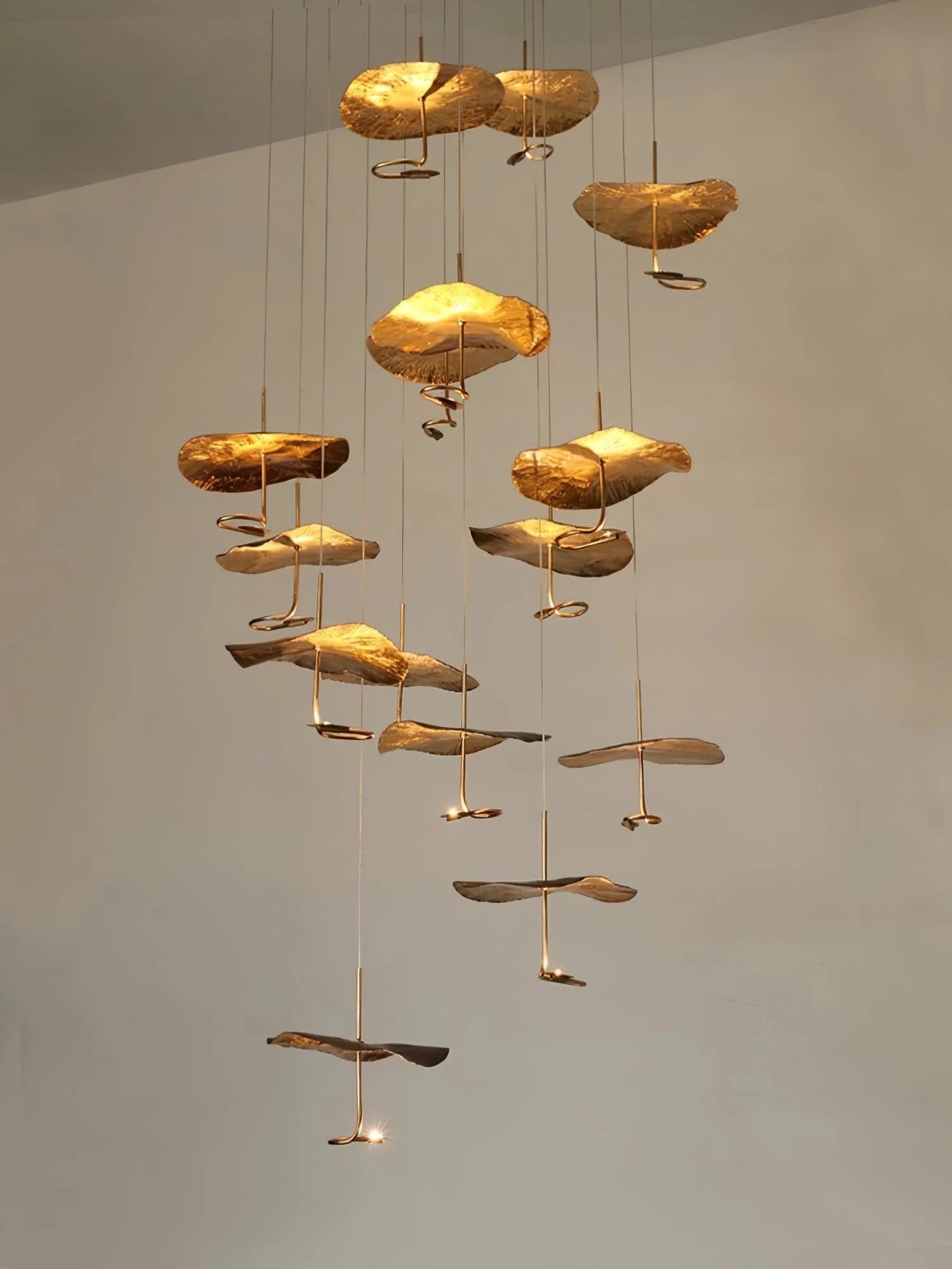 Jenissa Vintage Staircase Chandelier cascading product view with multiple gold lotus leaf pendant shades