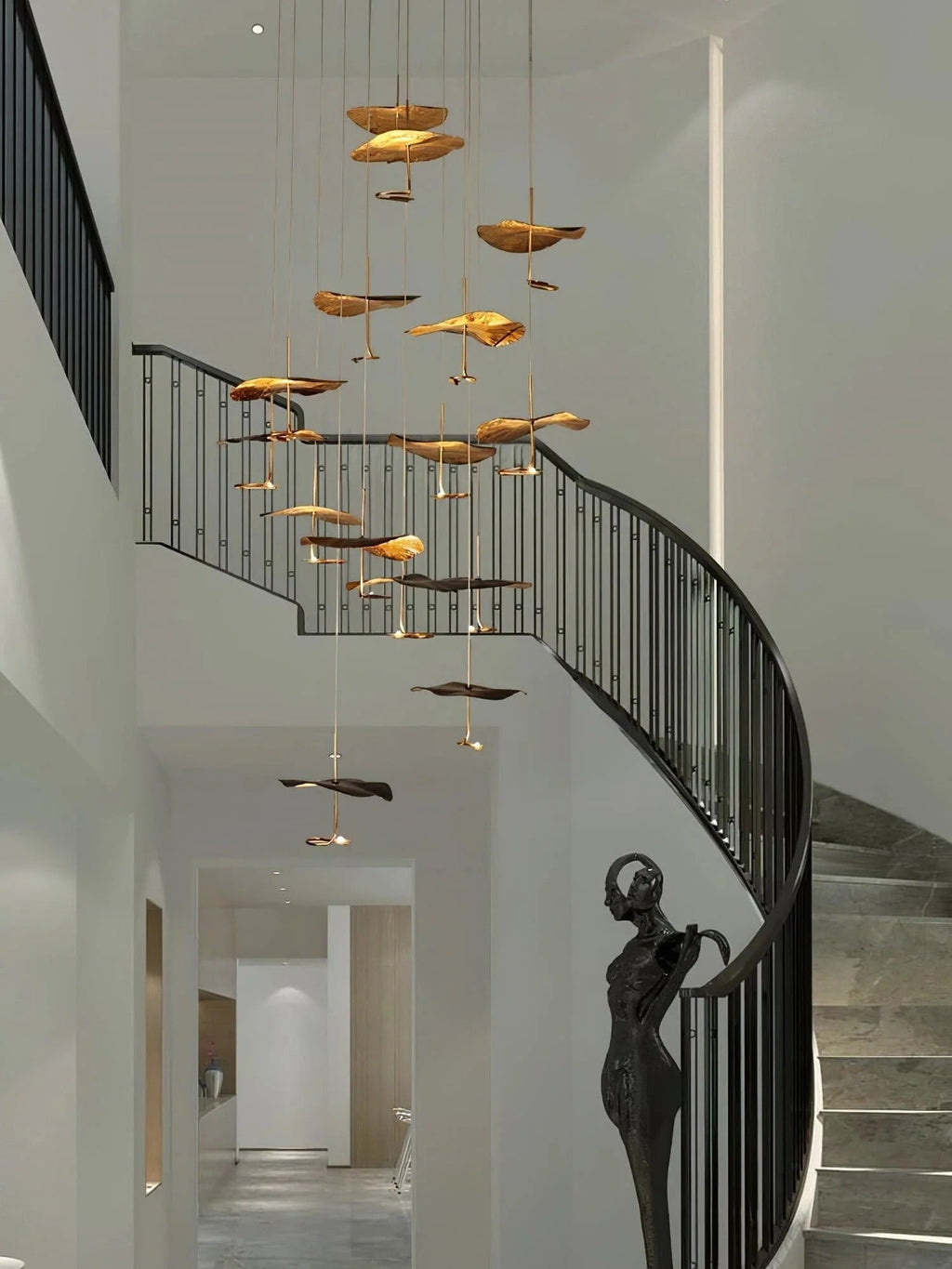 Jenissa Vintage Staircase Chandelier in a high ceiling hallway with curved staircase and gold leaf pendants
