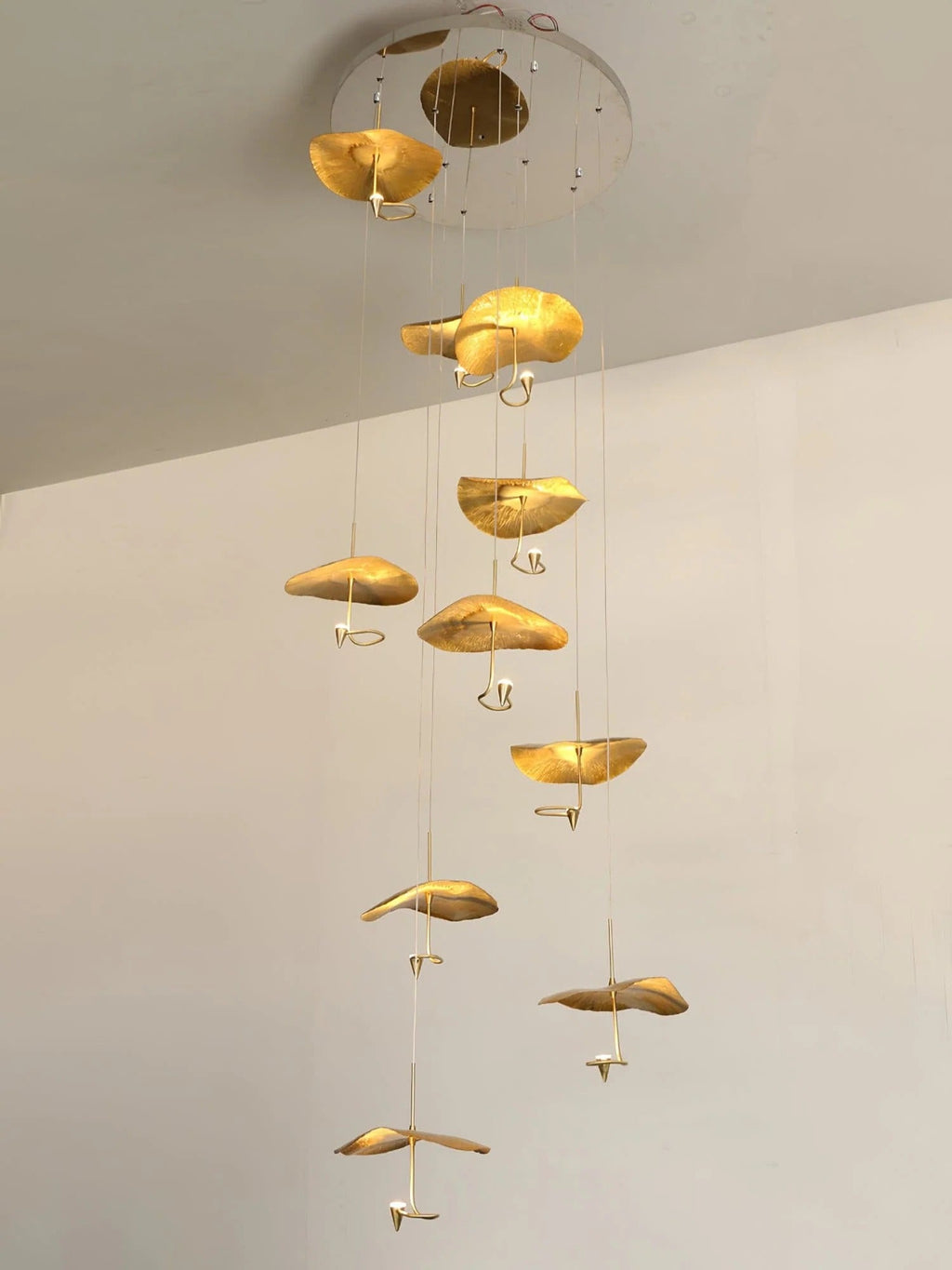 Jenissa Vintage Staircase Chandelier with gold lotus leaf pendants arranged in a vertical cascade