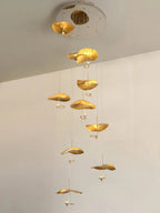 Jenissa Vintage Staircase Chandelier with gold lotus leaf pendants arranged in a vertical cascade