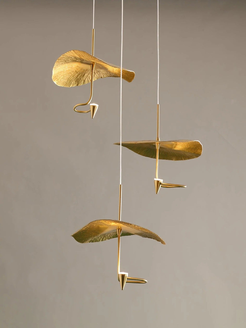 Jenissa Vintage Staircase Chandelier minimal view showing individual gold lotus leaf pendant shades