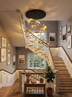 Jenissa Vintage Staircase Chandelier installed over a staircase entryway with gold lotus leaf lights