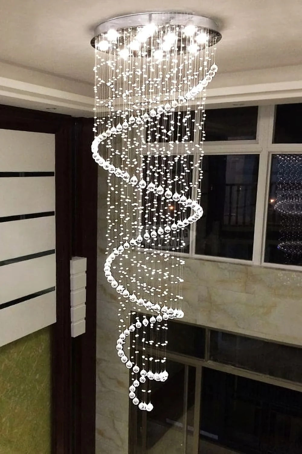 Large Foyer Lighting For High Ceiling and Entryway installed in a balcony stairwell with cascading crystals