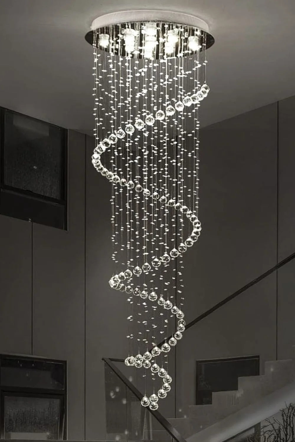 Large Foyer Lighting For High Ceiling and Entryway in a modern stairwell with spiral crystal strands