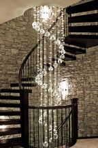 Large Foyer Lighting For High Ceiling and Entryway with spiral crystal strands beside a stone wall staircase