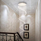 Large Foyer Lighting spiral raindrop crystal chandelier in a balcony hallway with ornate railing