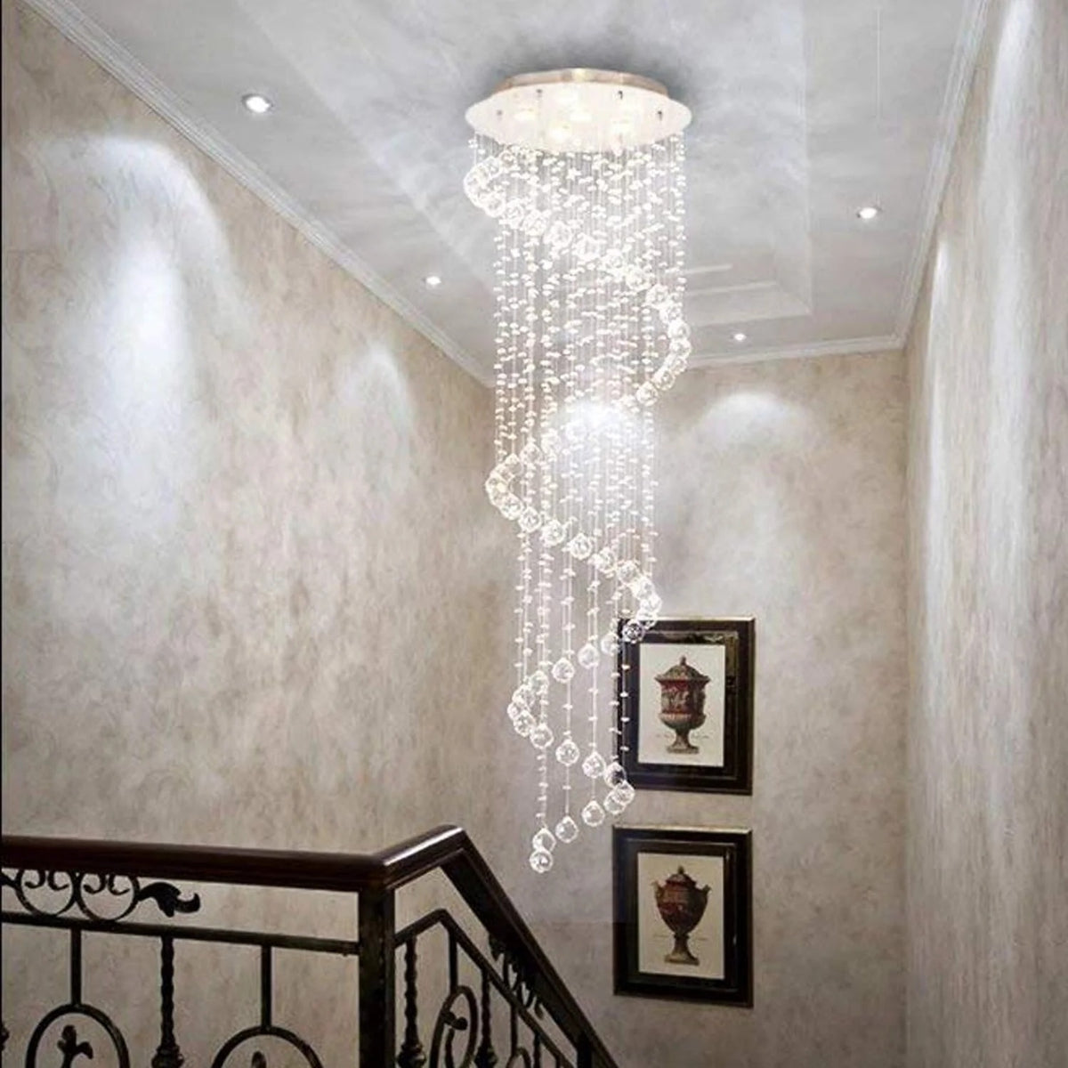 Large Foyer Lighting spiral raindrop crystal chandelier in a balcony hallway with ornate railing
