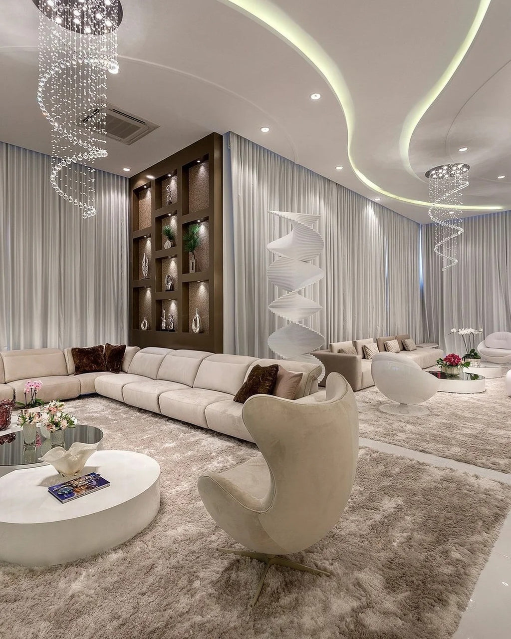 Large Foyer Lighting spiral raindrop crystal chandelier in a luxury living room with curved ceiling lights