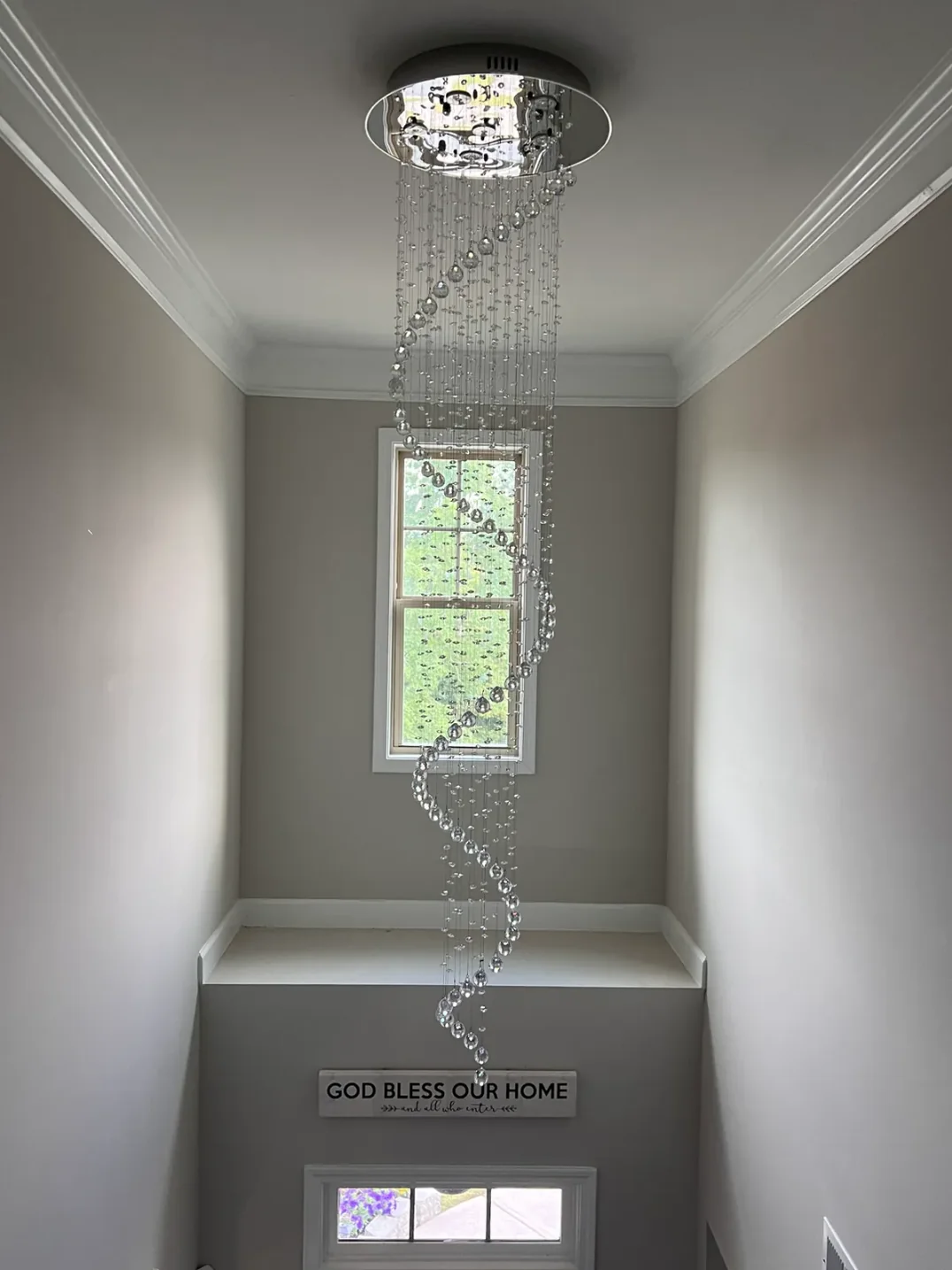 Large Foyer Lighting spiral raindrop crystal chandelier in a small stairwell with round canopy